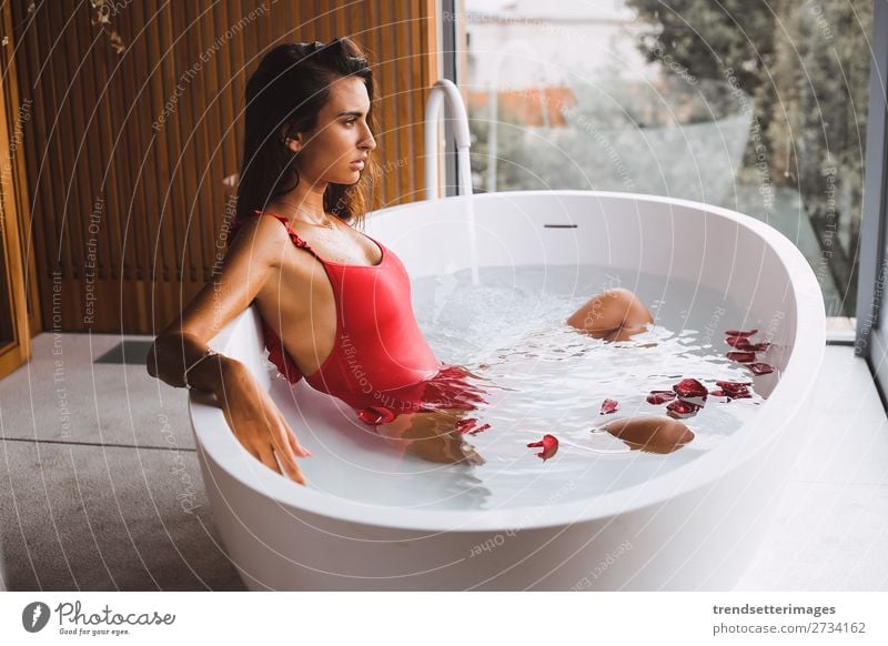 Woman Lying In Bathtub Filled With Charcoal Water A Royalty Free Stock Photo From Photocase