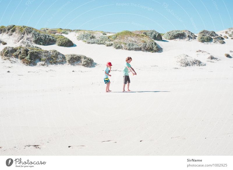 three people walking on a dune under cloudless sky - a Royalty Free Stock  Photo from Photocase