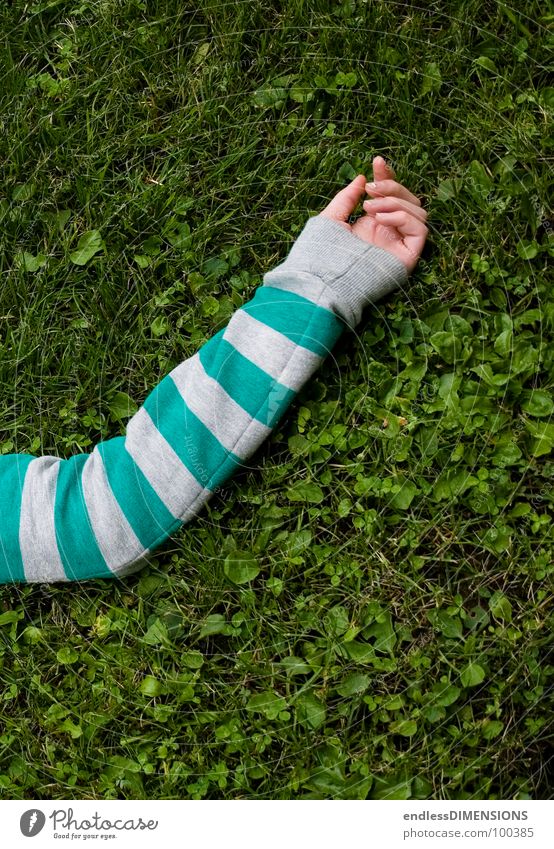 The arm Hand Meadow Grass Sweater Relaxation Green Turquoise Gray Clothing Summer Arm Lie Limbs Parts of body Striped sweater Break Bird's-eye view 1
