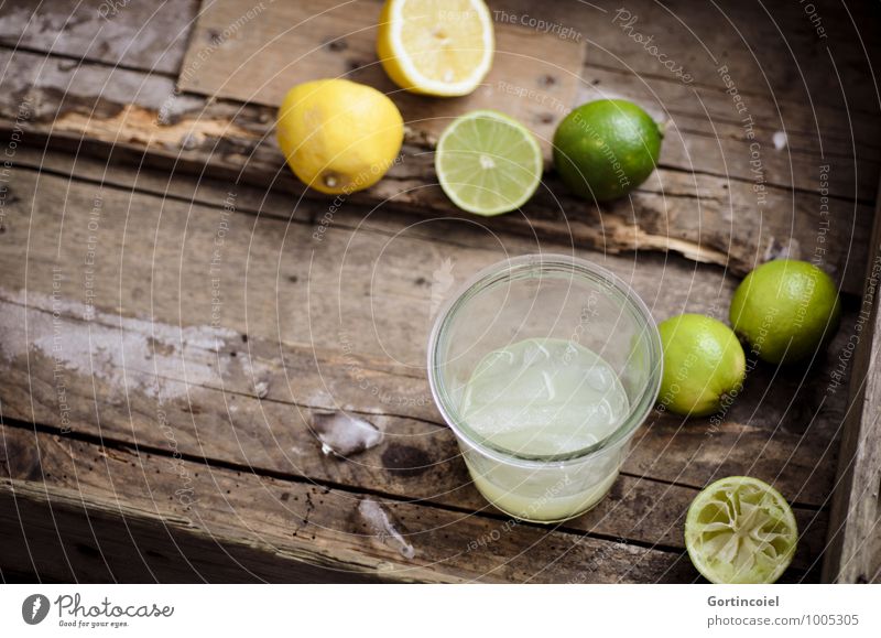 citron Food Beverage Cold drink Lemonade Juice Longdrink Cocktail Glass Fresh Delicious Brown Yellow Green Lime Ice cube Citrus fruits Colour photo