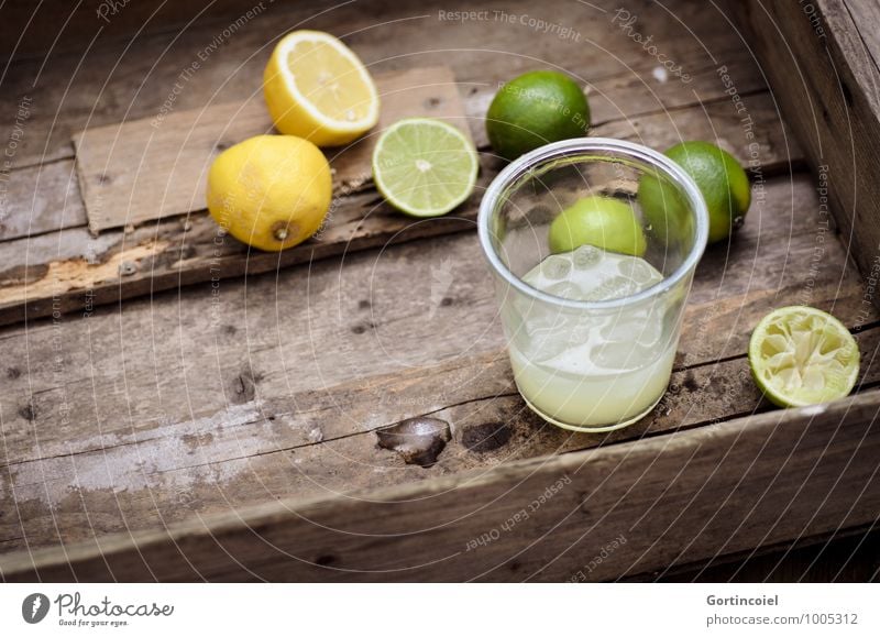 citrus juice Food Beverage Cold drink Lemonade Juice Longdrink Cocktail Glass Fresh Delicious Brown Yellow Green Lime Ice cube Citrus fruits Colour photo