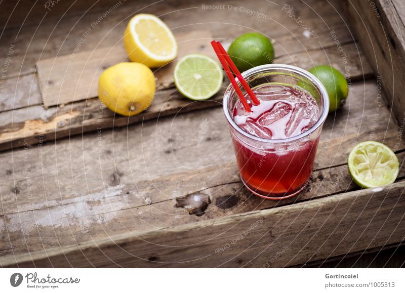 cocktail Food Beverage Cold drink Lemonade Juice Longdrink Cocktail Glass Fresh Delicious Brown Yellow Green Lime Ice cube Citrus fruits Colour photo