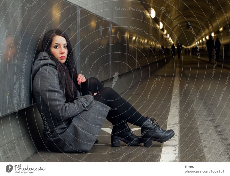 . Feminine Young woman Youth (Young adults) 1 Human being Hamburg Elbtunnel Coat Boots Black-haired Long-haired Observe Looking Sit Wait Dark Beautiful
