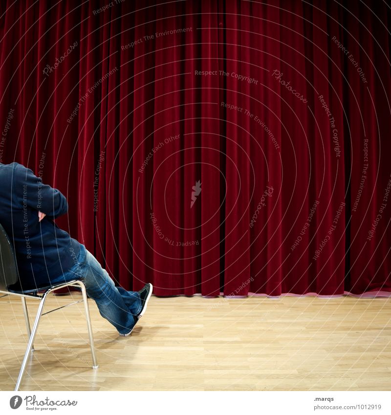 expectations Event Human being Masculine 1 Shows Cinema Drape Sit Wait Red Anticipation Curiosity Interest Expectation Future Colour photo Interior shot Pattern