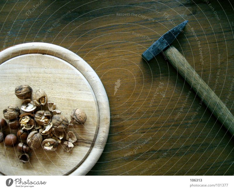 THE GERMAN NUTCRACKER Food Nutrition Bowl Table Energy industry Tool Hammer Wood Power Force To break (something) Hazelnut Shatter Nutcrackers