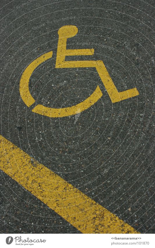 Wheelchair Downhill Yellow Gray Lettering Pictogram Logo Handicapped Parking lot Speed Action Exceptional Stripe Concrete Street sign Signs and labeling Signal