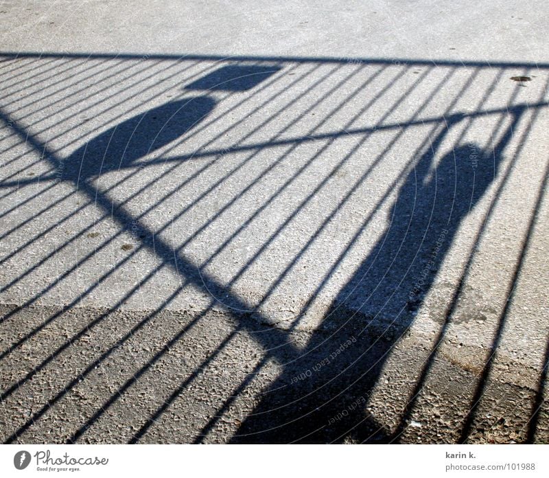 hang out Fence Child Boy (child) Asphalt Hang Shadow play Relaxation Arm