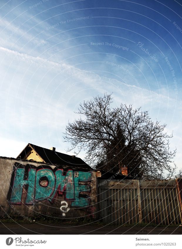 Home is where the graffiti is Sky Clouds Tree Town Outskirts House (Residential Structure) Detached house Wall (barrier) Wall (building) Identity Building Roof