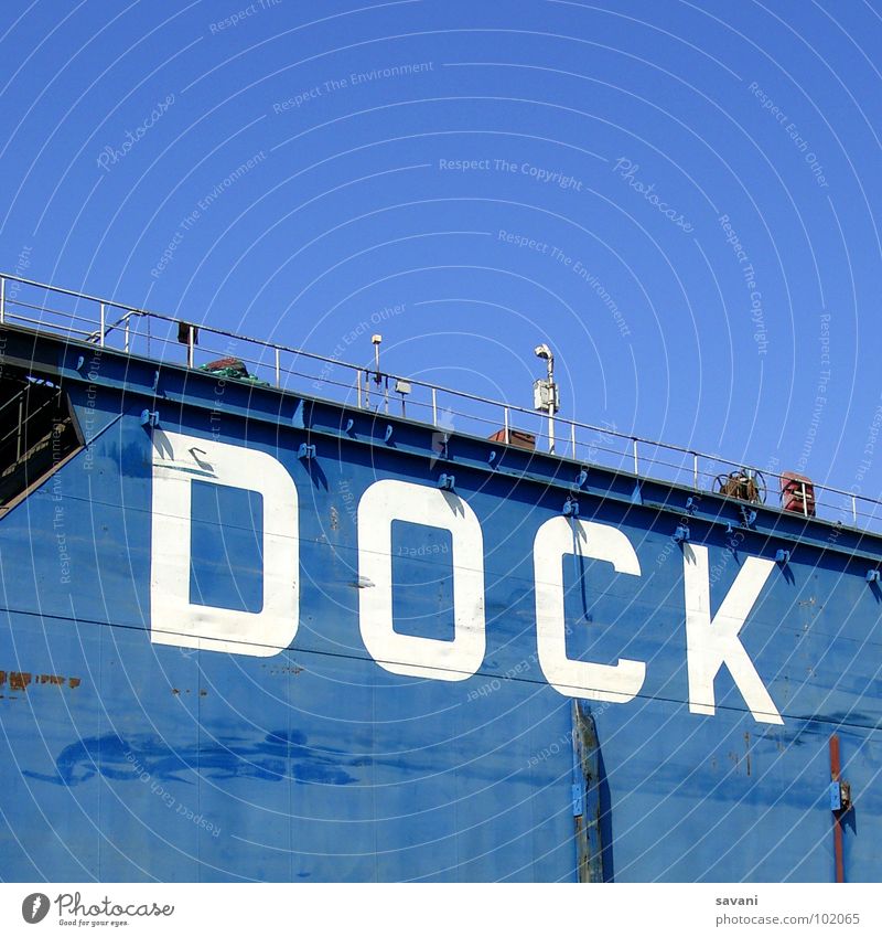 Dock in the port of Hamburg Summer Sky Beautiful weather River Harbour Wall (barrier) Wall (building) Watercraft Characters Blue White Letters (alphabet) Elbe