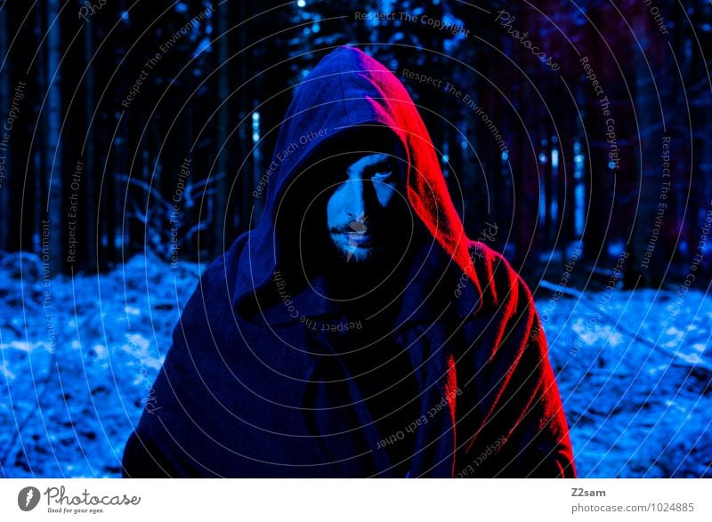 Dark Night Masculine Man Adults 30 - 45 years Nature Landscape Tree Bushes Forest Coat Hooded (clothing) Robe Facial hair Looking Cold Blue Red Anger Uniqueness