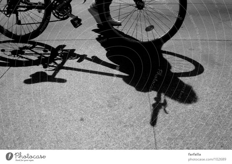 Bicycle... Bicycle... Light Dark Pedestrian Pedal Human being Black & white photo Shadow Street road Feet Wheel Cycling