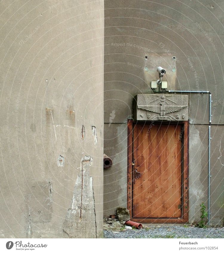 What needs to be secured... Colour photo Exterior shot Deserted Industry Video camera Factory Wall (barrier) Wall (building) Door Concrete Threat Gloomy Gray