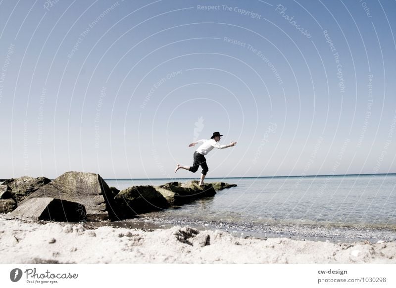 Young man on the beach of Hiddensee believe in God Belief religion person Beach Water Lake Walking cut across the water