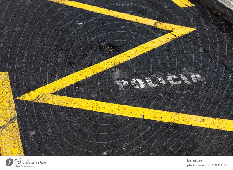 police Town Places Transport Street Car Line Yellow Black White Spanish Police Force Parking lot Asphalt reserved Room writing Zigzag policia Clearway Tar