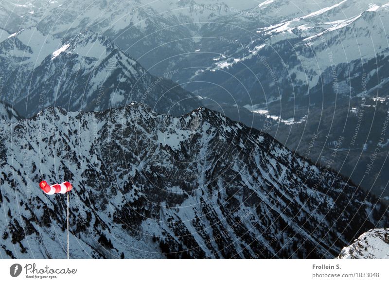 Jodeldö di Dödeldu Environment Nature Landscape Winter Wind Snow Alps Mountain Snowcapped peak Windsock Far-off places Red Black White Deep Colour photo