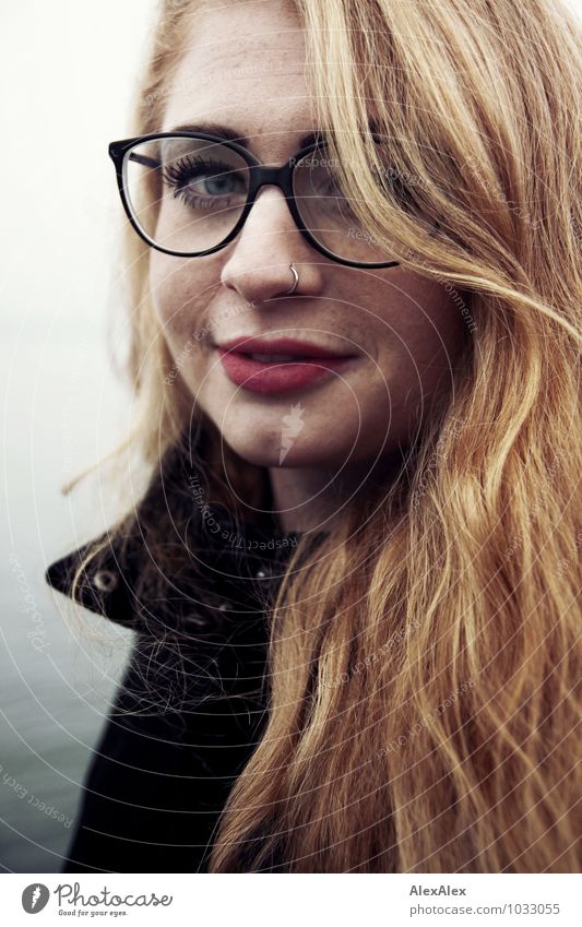 waves Trip Young woman Youth (Young adults) Face Freckles brood 18 - 30 years Adults Coat Eyeglasses Red-haired Long-haired Smiling Looking Esthetic Exceptional