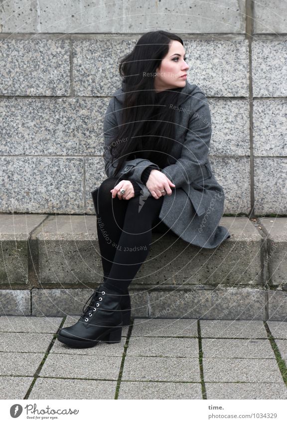 . Feminine Young woman Youth (Young adults) 1 Human being Wall (barrier) Wall (building) Coat Piercing Footwear Black-haired Long-haired Observe Think Looking