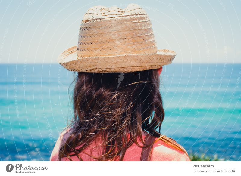 Excursion, Girl with sun hat on the beach of the blue ocean and looking at the sea Joy Relaxation Ocean Hiking Feminine Hair and hairstyles 1 Human being