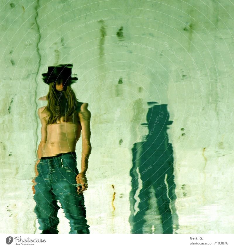 stand by Stand Reflection Calm Grow hazy Distorted Pants Green Man Young man Upper body Stomach Top hat Hair and hairstyles Long-haired Faceless Green undertone