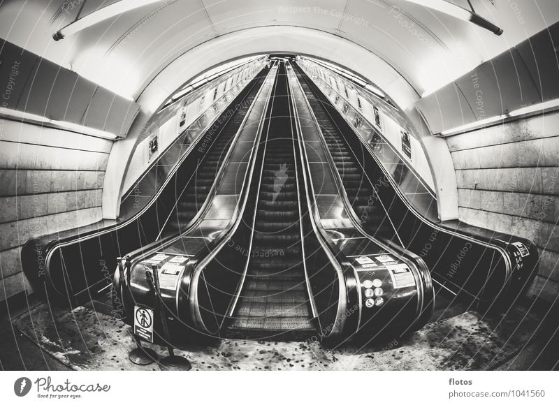Stairway to ... Town Deserted Train station Tunnel Manmade structures Stairs Public transit Gray Black White Loneliness Escalator Black & white photo