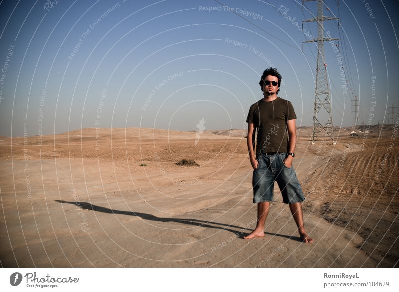 Streamlined Israel Negev Hot Electricity Electricity pylon Sunglasses Evening sun Summer Desert Man Blue Sky Sand Energy industry Shadow