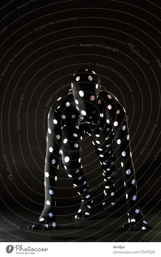 male figure in a black morphsuite with white dots in starting position Morph Suite Masculine Start position Androgynous 1 Human being 18 - 30 years