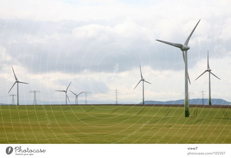 wind power Energy industry Renewable energy Wind energy plant Industry Sky Clouds Grass Meadow Field Free Large Tall Long Speed Yellow Green Power Success