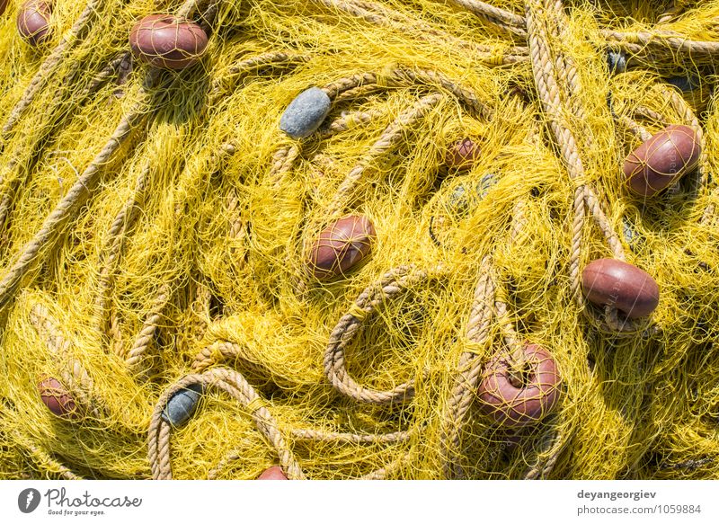 Fishnets on fish boat. Yellow net. Seafood Ocean Industry Rope Harbour Watercraft Line Old Maritime fishing fishnet equipment marine knot catch Consistency