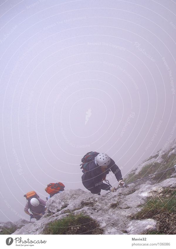 The mountain calls Fog Steep face Joy Leisure and hobbies Sports Playing Mountain Climbing Effort Level via ferrata Above