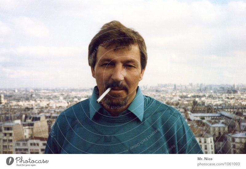 Above the roofs of Paris Lifestyle City trip Masculine Man Adults Father Town Sweater Hair and hairstyles Facial hair Retro Turquoise Contentment Self-confident