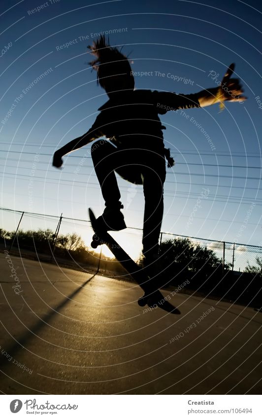 Skateboarder in silhouette Youth (Young adults) Skateboarding Trick Jump Sunset Extreme sports boy teenage Sports skinny youth young rebel hair Parking level