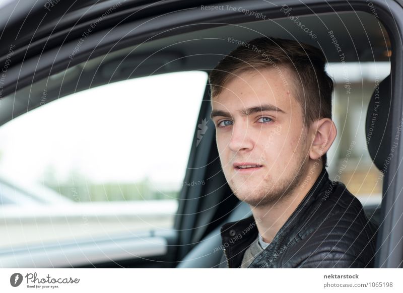 Portrait of Young Man in Drivers Seat of Car Human being Young man Youth (Young adults) Face 1 18 - 30 years Adults Driving driver's seat Caucasian Close-up Day