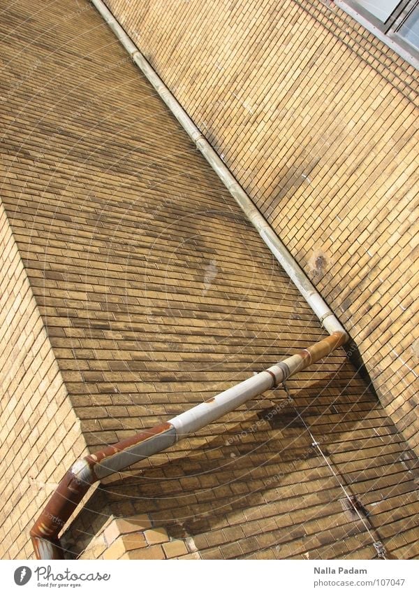 Simple downpipe or The art of steering water Wall (building) Brick Ochre Downspout Sharp-edged Historic Drainage Roof Downward Industry Stone Downpipe Rust
