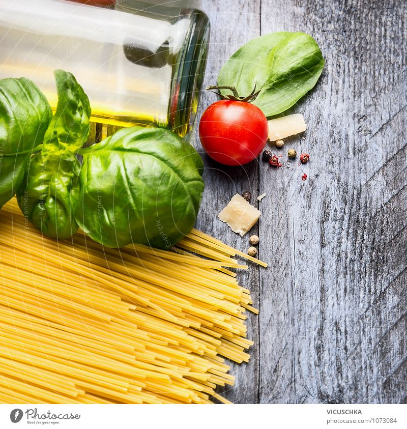 Spaghetti ingredients on a blue wooden table Food Vegetable Dough Baked goods Herbs and spices Cooking oil Nutrition Lunch Organic produce Vegetarian diet Diet
