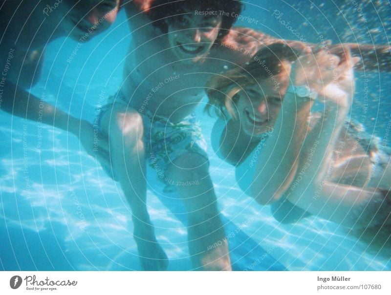 Body of young woman underwater in a swimming pool stock photo