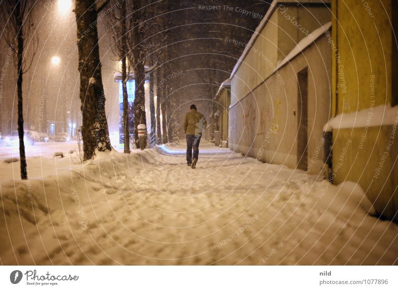 out and about at night Human being Masculine Man Adults 1 Winter Weather Storm Snow Snowfall Munich Town Wall (barrier) Wall (building) Pedestrian Street