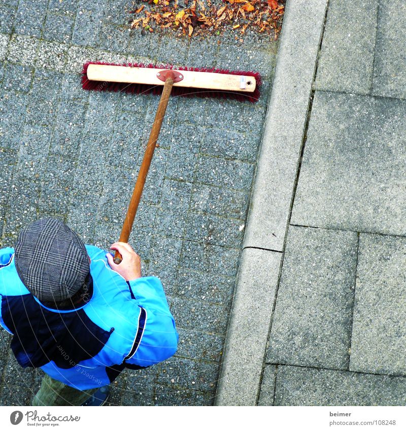 Caretaker II Broom Sweep Bristles Pave Parking lot Leaf Cap Man Janitor Autumn Work and employment Clean Cleaning Services cobblestones Lanes & trails Weather