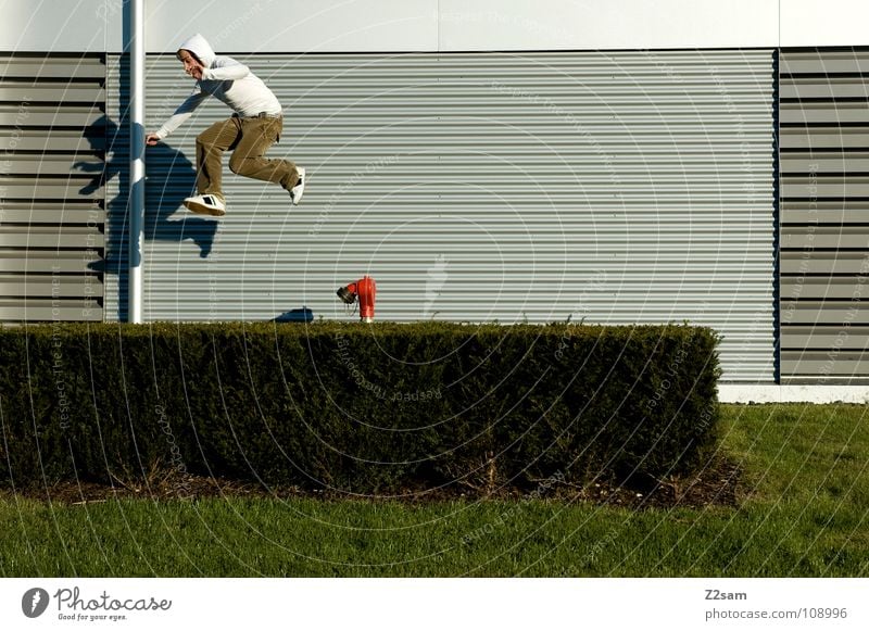 cursed Dangerous To fall Beginning Bushes Direct White Fire hydrant Red Adjustment Jump Action Hop Easygoing Youth (Young adults) Edge Hedge Green Pattern Man