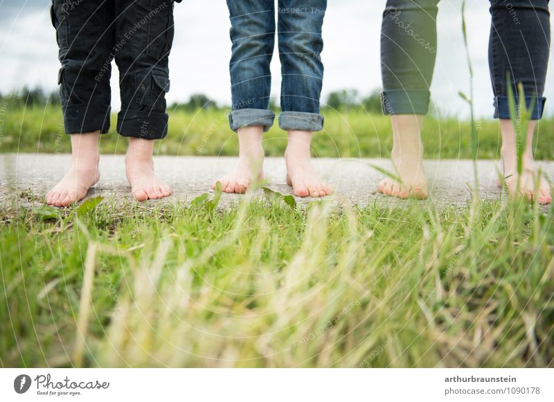 Feet on the street in front of the meadow Lifestyle Parenting Human being Masculine Feminine Child Woman Adults Parents Mother Brothers and sisters