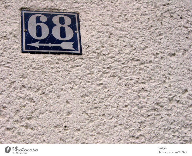 <___68 House number Digits and numbers Wall (building) sixty