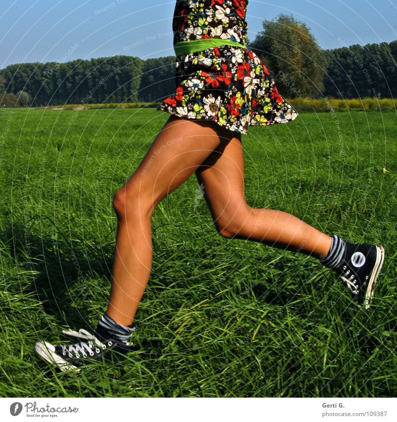 Where's it going? Jogging Dress Woman Young woman Thin Firm Wiry Healthy Leisure and hobbies Meadow Hundred-metre sprint Running Chucks Brown Summer Summery