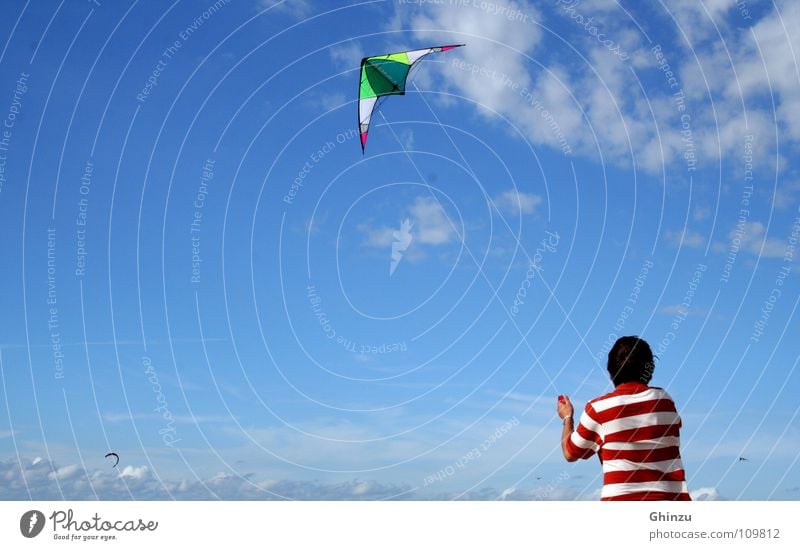 Kite runner Kiting Red White Man Beach Playing Celestial bodies and the universe Youth (Young adults) Sky heaven blue Dragon june Hang gliding Flying fly