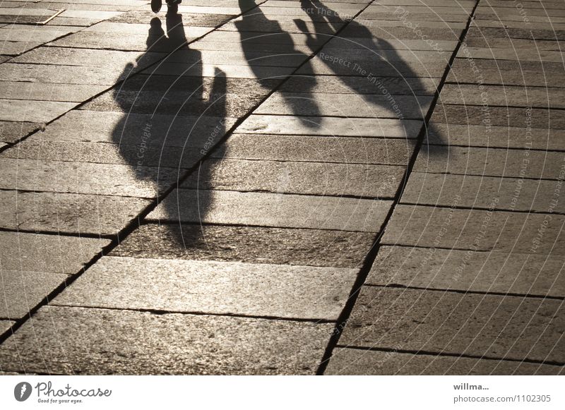 downsides Group people 3 persons Family Places Sightseeing City life To go for a walk Weekend Shadow play Paving tiles Family outing Light and shadow Tourism