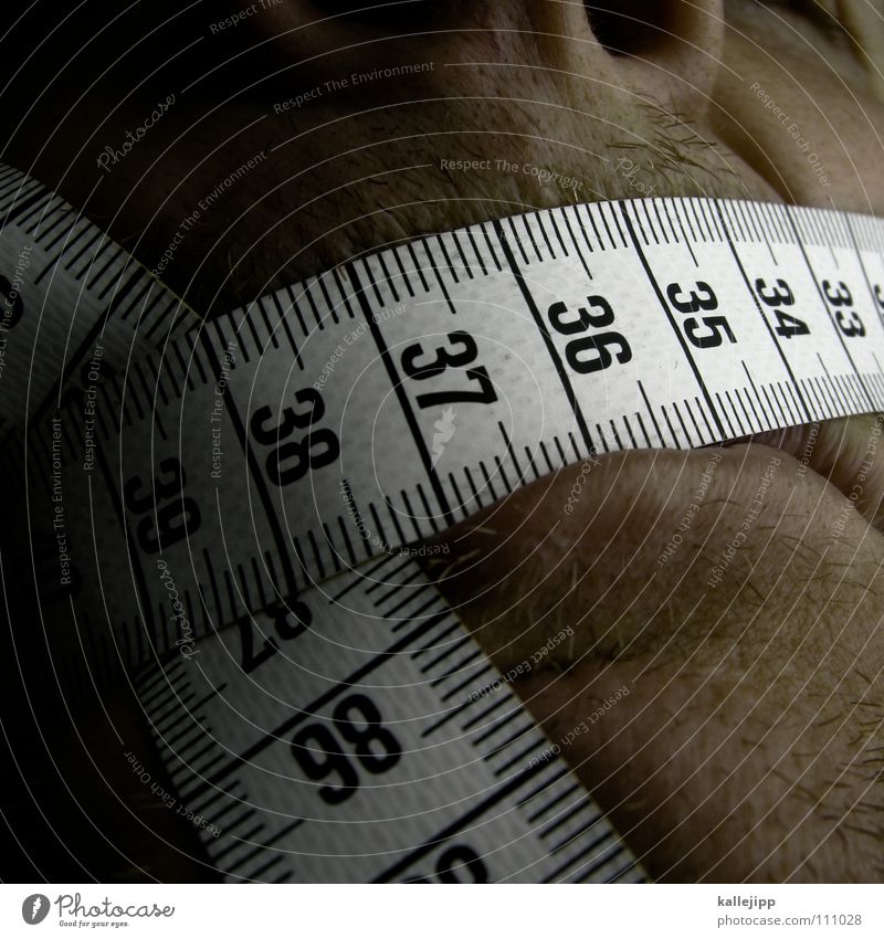 Yellow tailor tape measure on a wooden table, close up - a Royalty Free  Stock Photo from Photocase