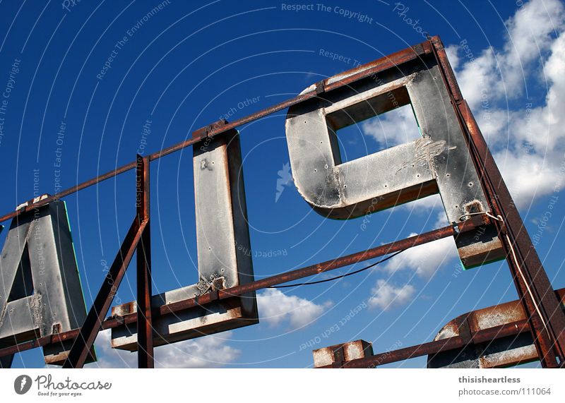 nightmare Letters (alphabet) Capital letter Watchfulness Clouds Steel Remote Vantage point Detail Joy Summer Characters Advertising Blue Sky Scaffold hotel roof