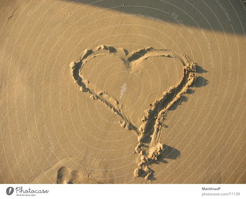 Heart in the sand Love Beach Ocean Vacation & Travel Lake Europe Summer coast Sand heart Relaxation sea Water Nature Sun Deserted Exterior shot Colour photo