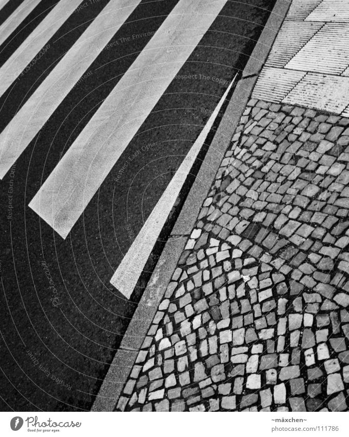 zebra crossing Zebra crossing Street crossing Dangerous Cobblestones Curbside Black White Square Diagonal Stripe Asphalt Hard Going Traverse Yield sign