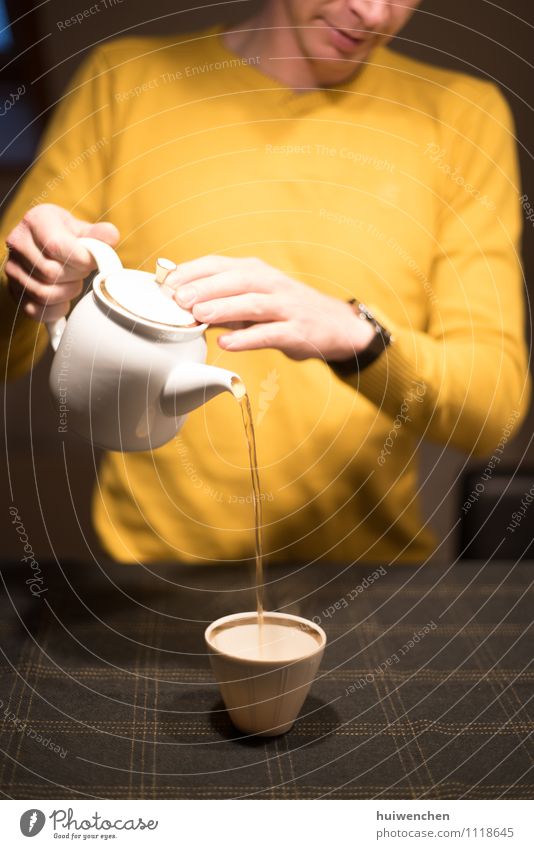 start to serve the tea Beverage Hot drink Tea black tea Pot Mug Tea cup Teapot Elegant Man Adults Hand Fingers 1 Human being Tablecloth To hold on Friendliness