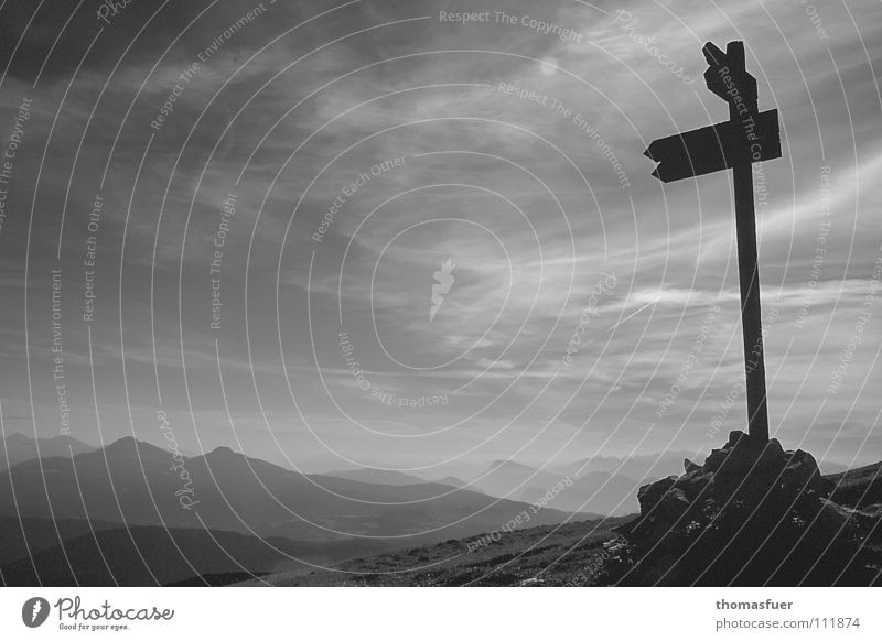 Mountains with signpost in bw Evening sun Drop shadow Clouds Companion Far-off places Lanes & trails Hope Self-confidence Horizon Black & white photo