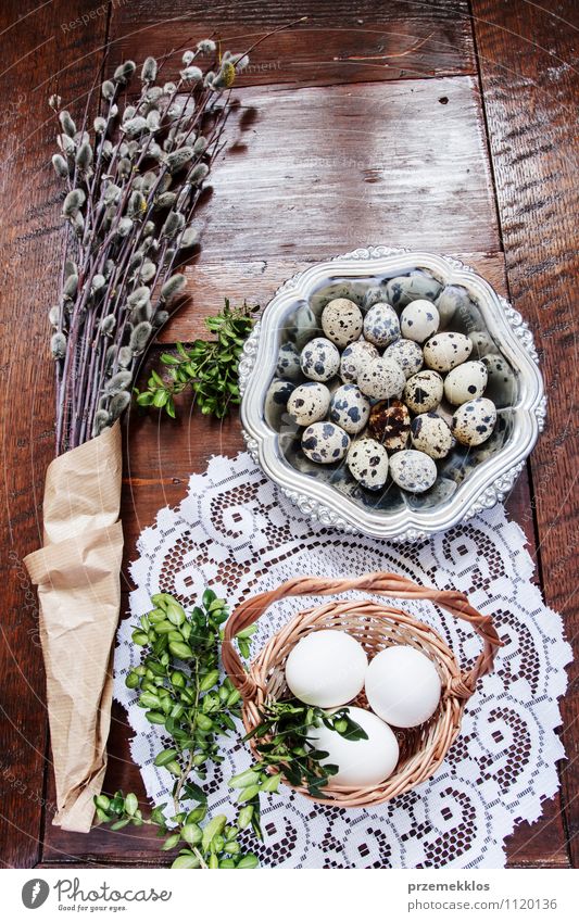 Easter composition of eggs, catkins and boxwood on wooden table Decoration Table Spring Paper Wood Metal Natural Brown Green Tradition Basket bobwhite candid